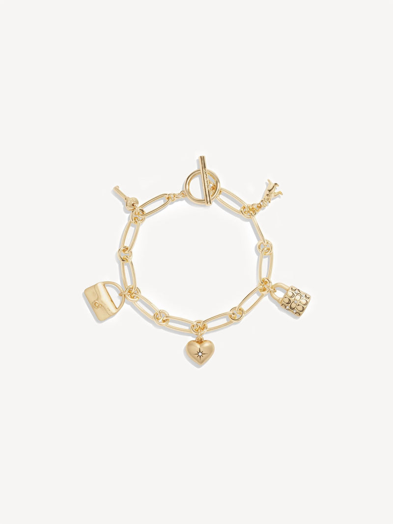 Coach gold tone charm bracelet - British product