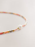 Orange beaded anklet, imported from the UK