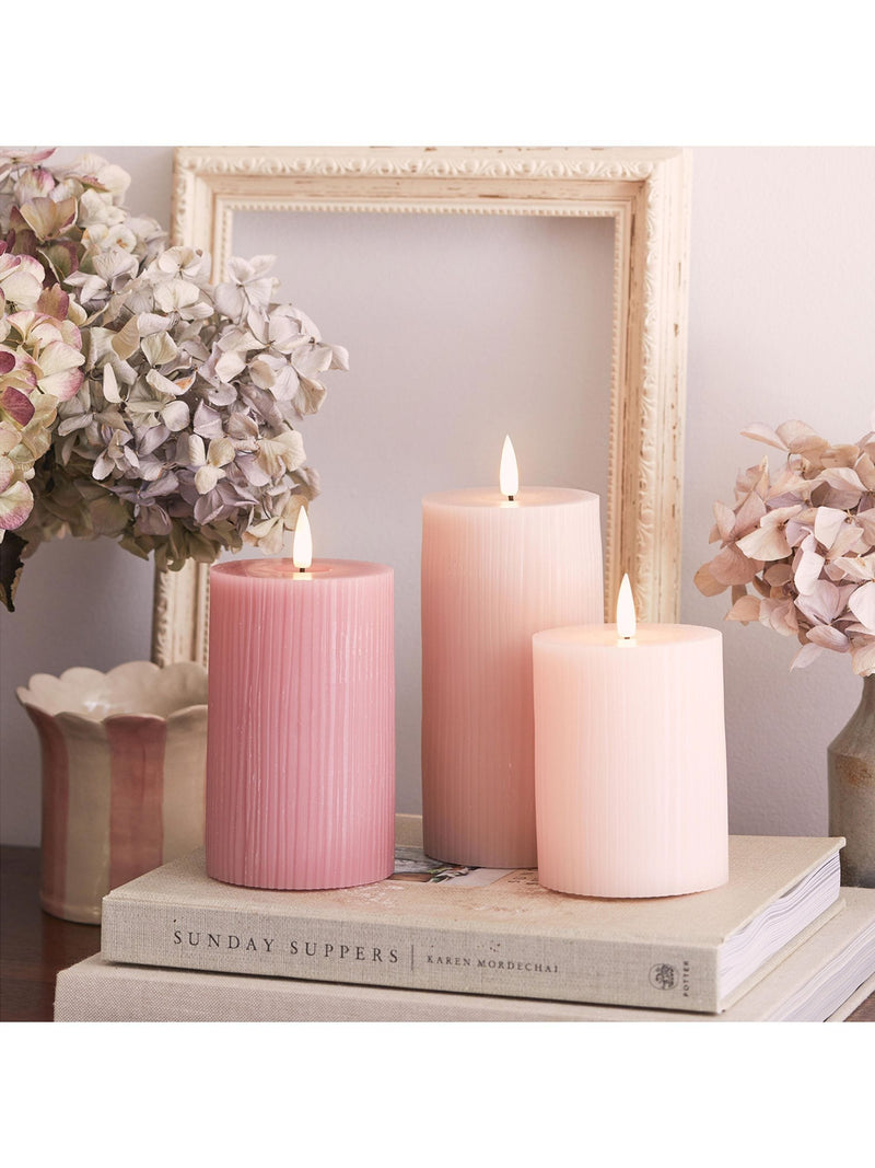 Lights4fun pink LED pillar candle trio with varying heights, UK version
