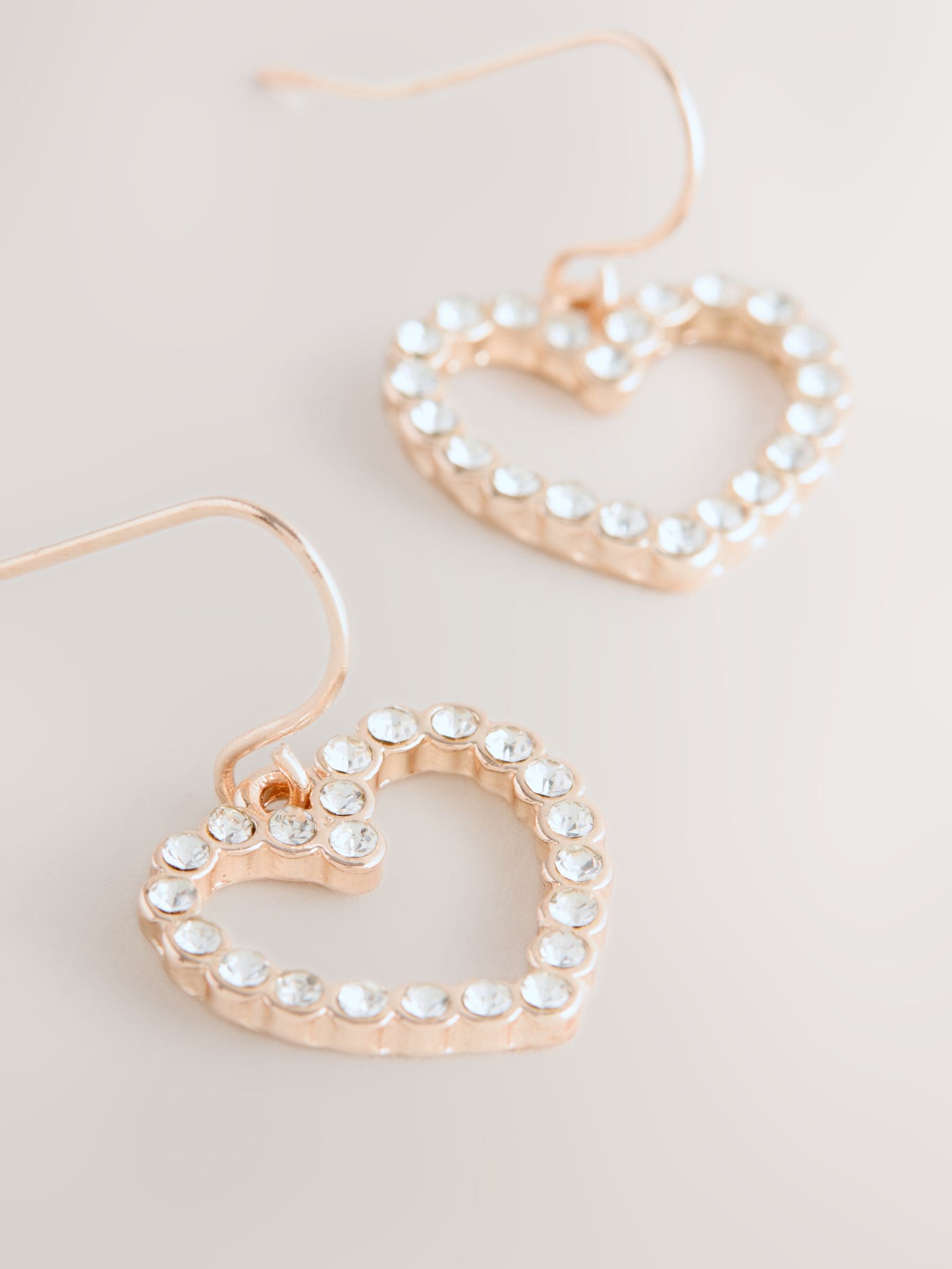 Rose gold tone pavé heart drop earrings, imported from the UK