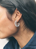 Silver tone crossover hoop earrings (British brand)