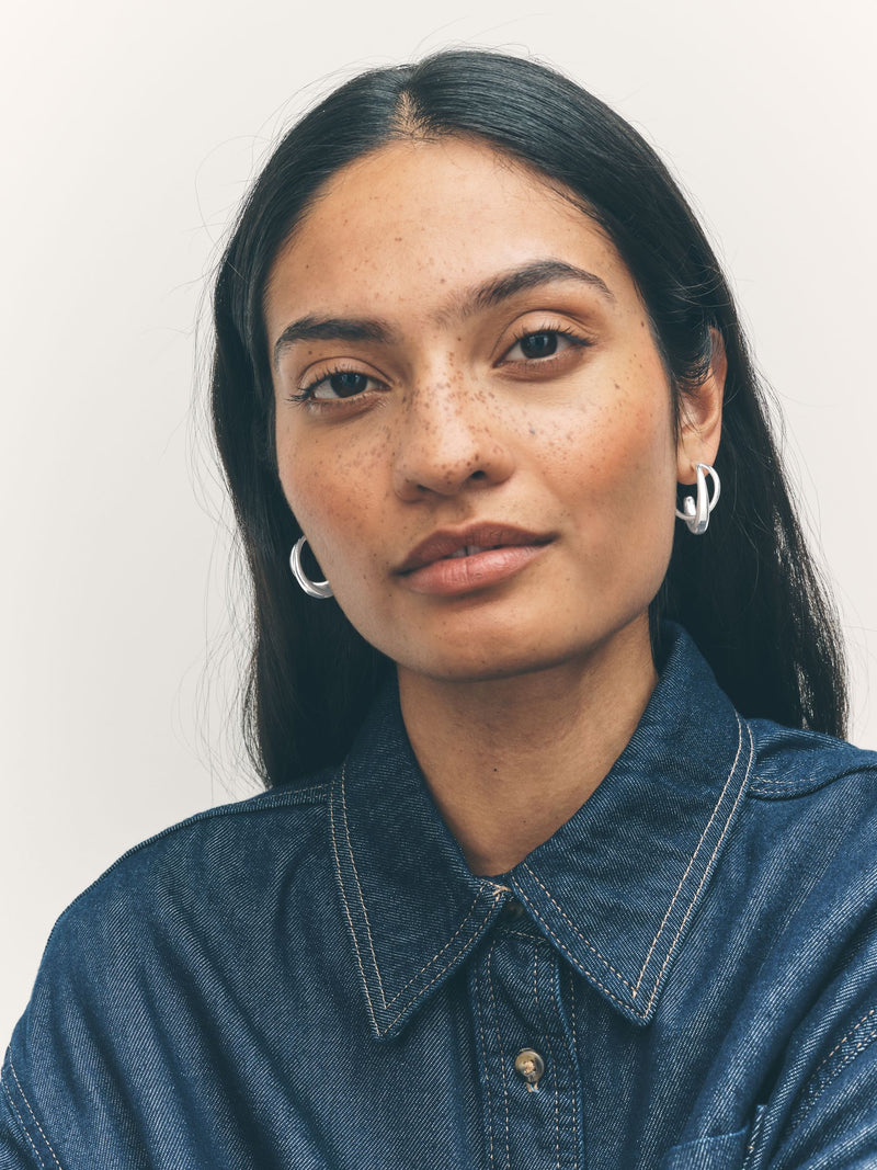 Silver tone crossover hoop earrings (British brand)