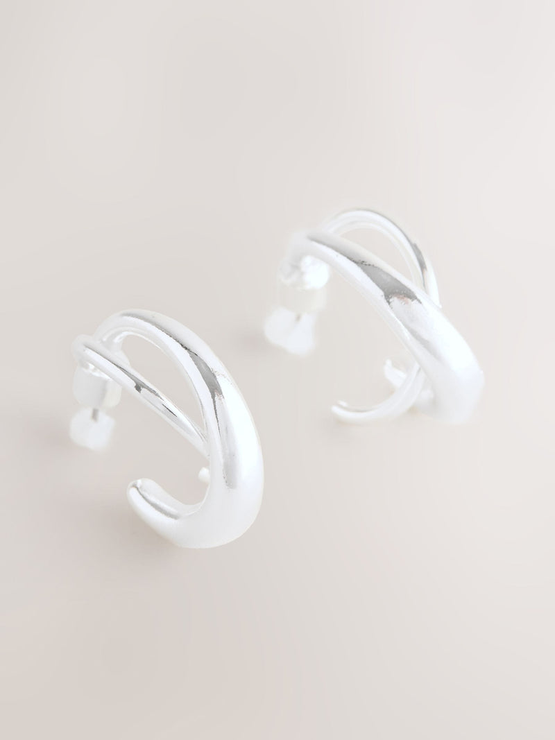 Silver tone crossover hoop earrings (British brand)