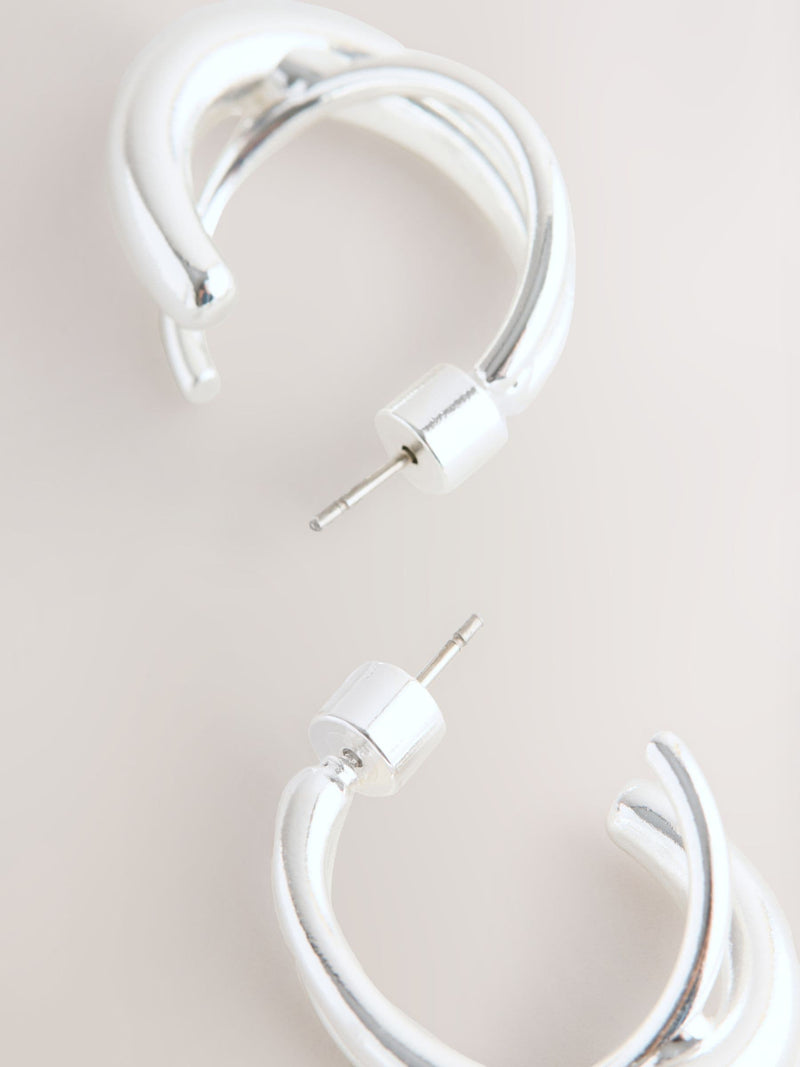 Silver tone crossover hoop earrings (British brand)