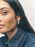 Silver tone crossover hoop earrings (British brand)