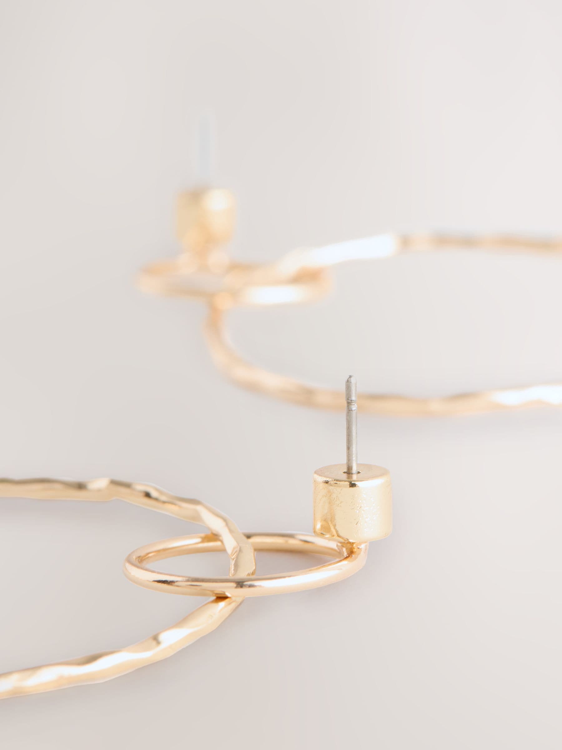 Gold Tone Circle Drop Earrings 91% Recycled brass, UK version