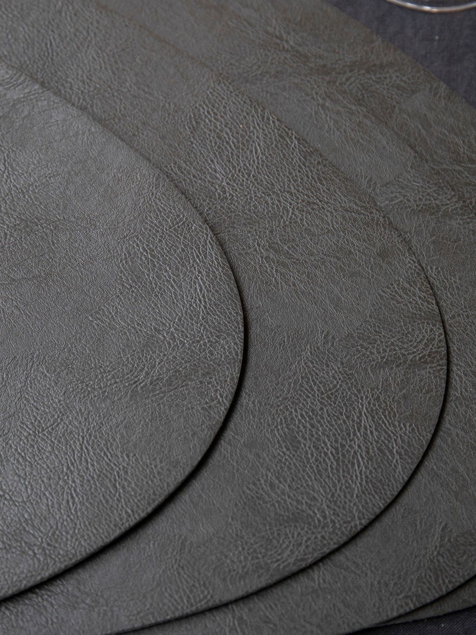 Mikasa black pebble-shaped faux leather placemat set of 4, imported from the UK