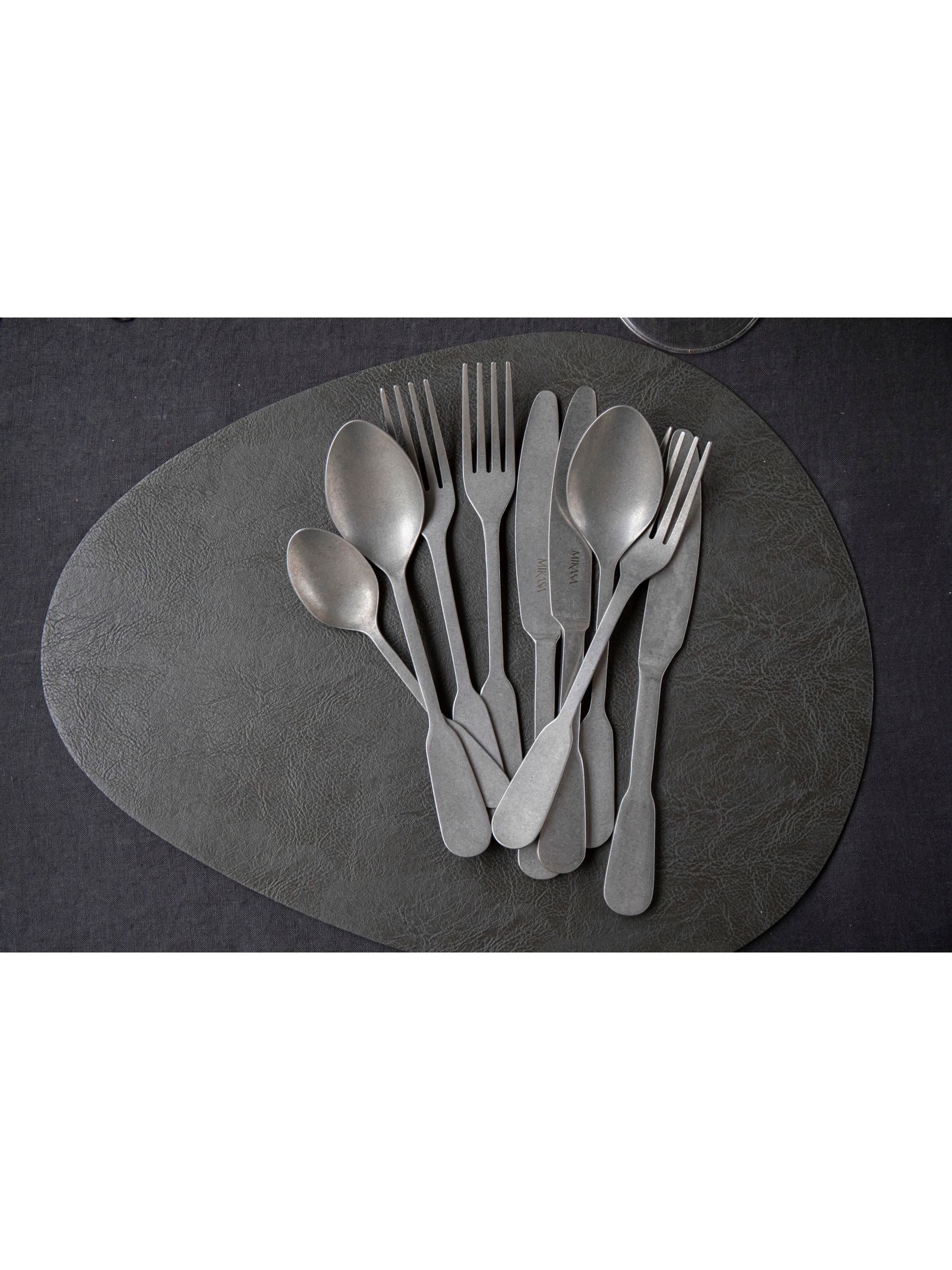Mikasa black pebble-shaped faux leather placemat set of 4, imported from the UK