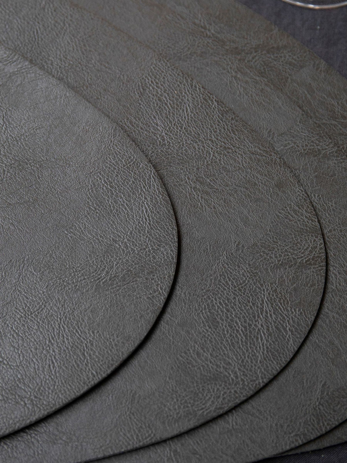 Mikasa black pebble-shaped faux leather placemat set of 4, imported from the UK