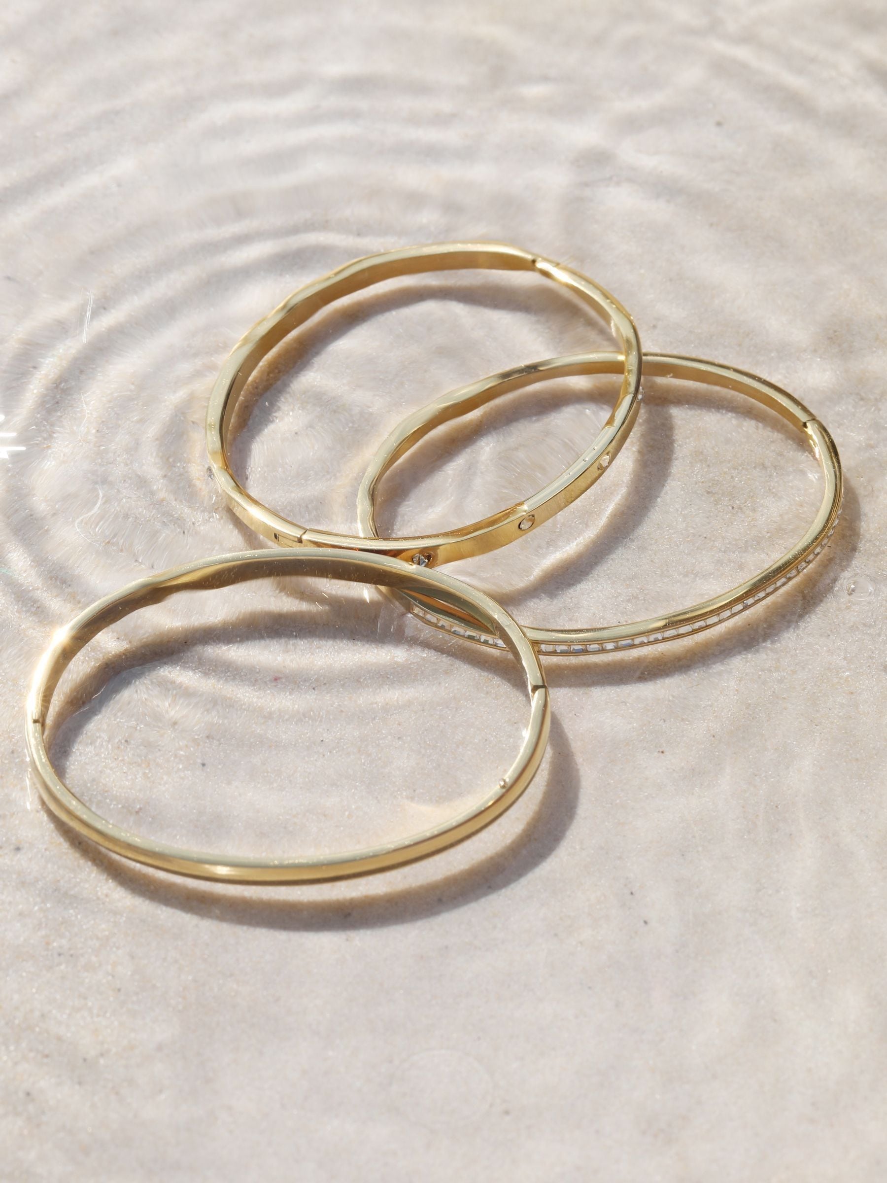 Jon Richard gold plated stainless steel waterproof bangle, UK version