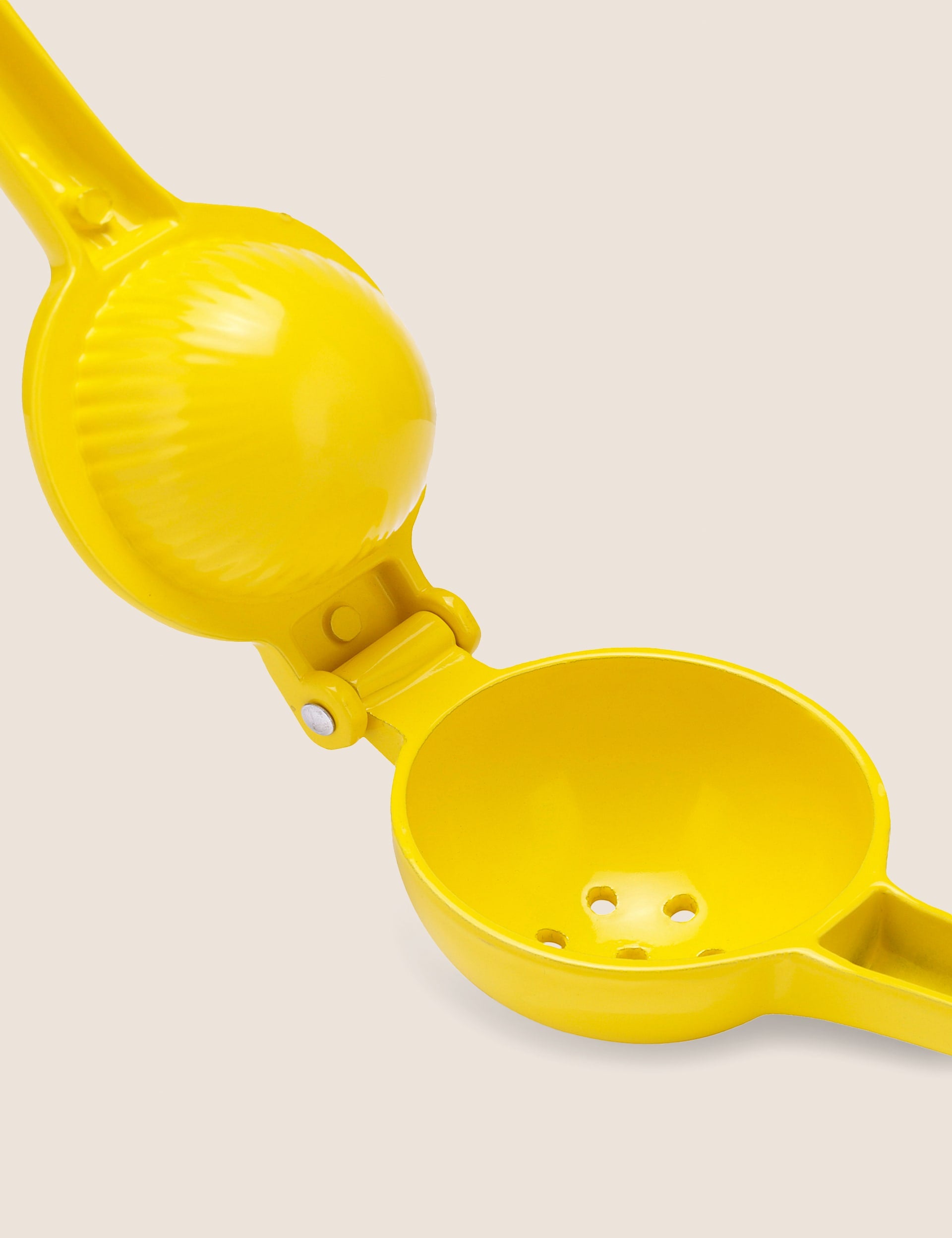 Handheld metal lemon squeezer, UK version