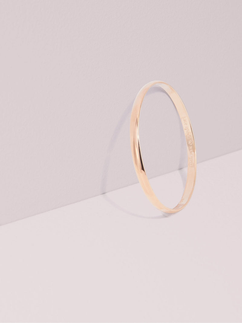 Kate Spade rose gold tone idiom bangle, UK version