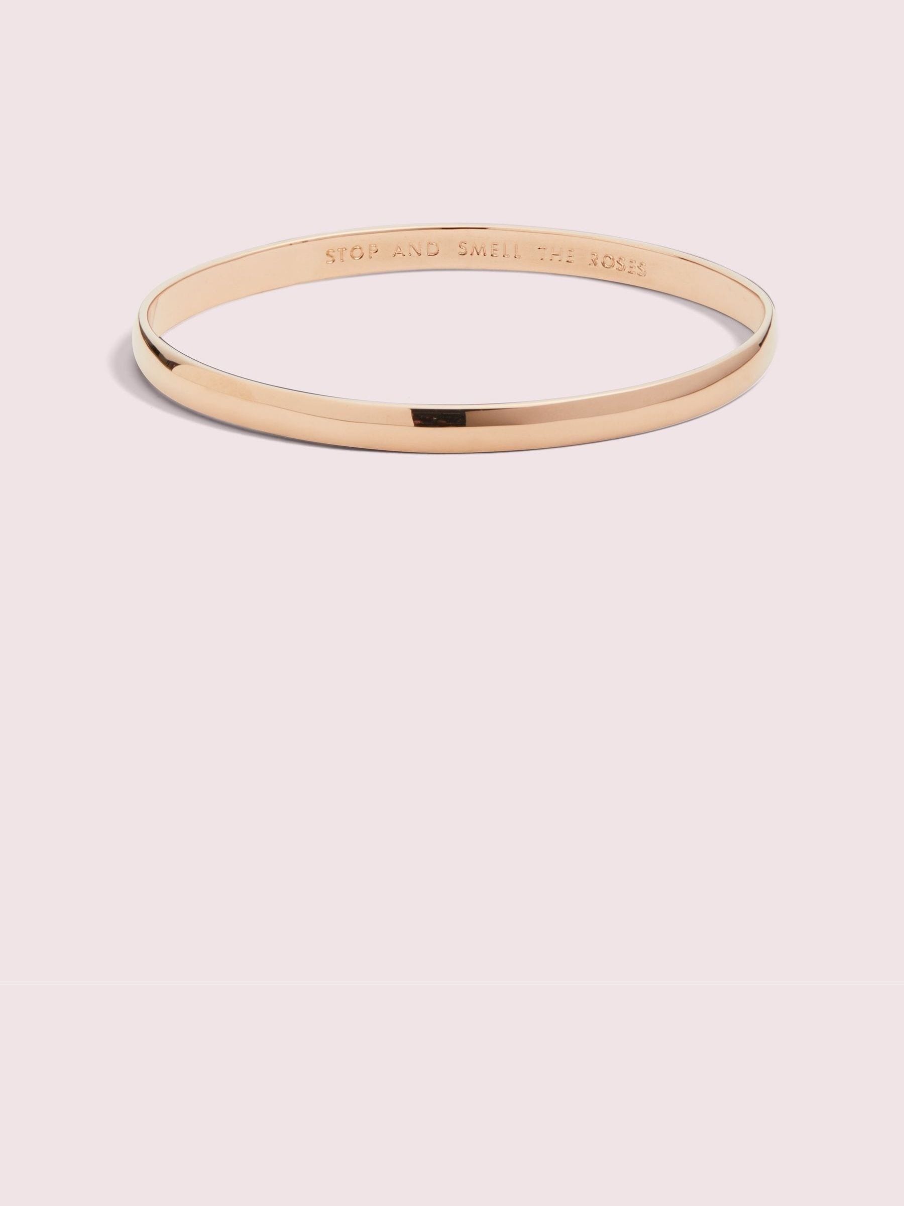 Kate Spade rose gold tone idiom bangle, UK version
