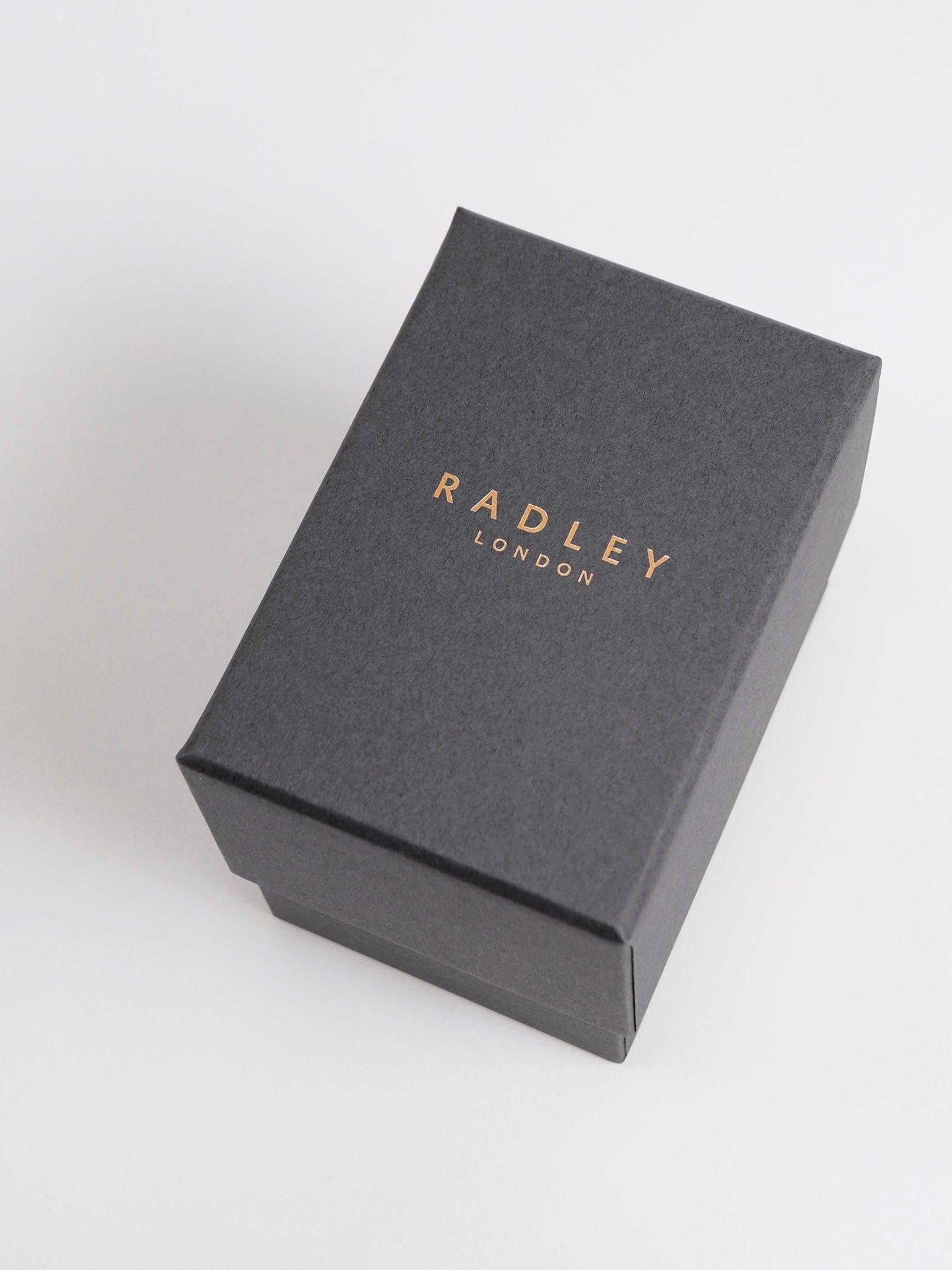 Radley Pink Ladies smartwatch with rose cobweb design, imported from the UK