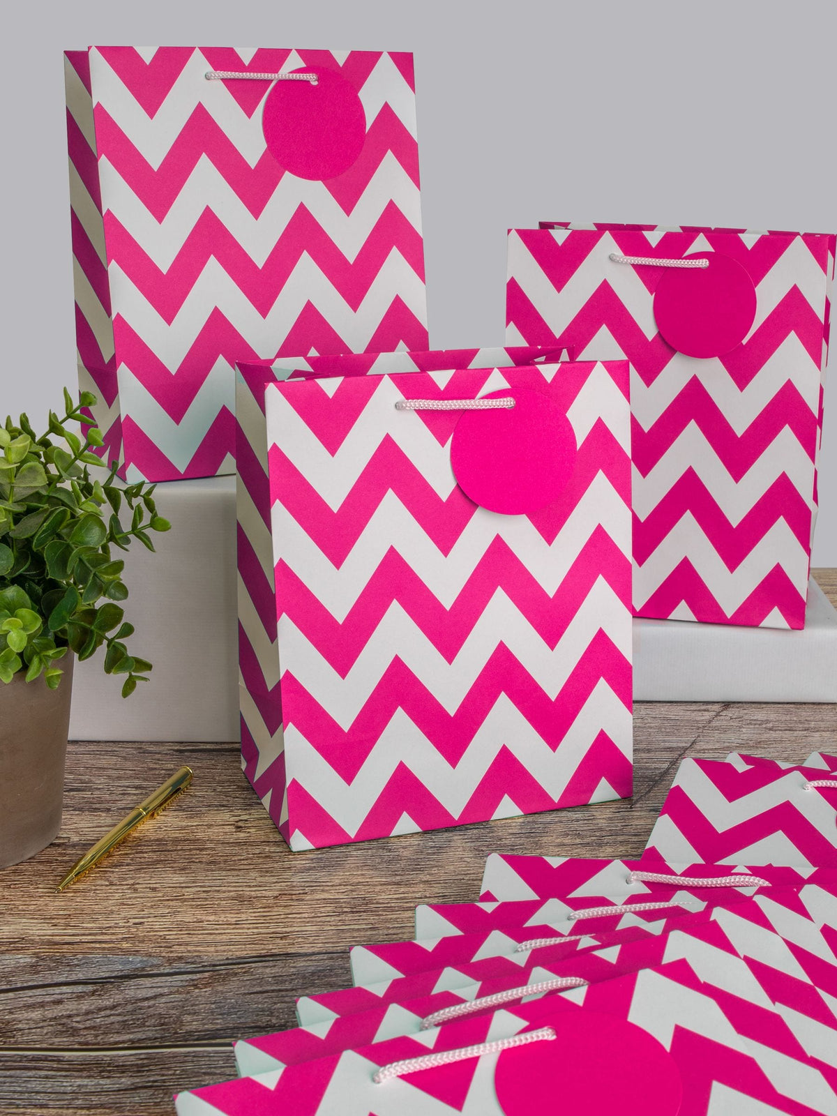 Hallmark pink medium gift bags with zig-zag design, UK version