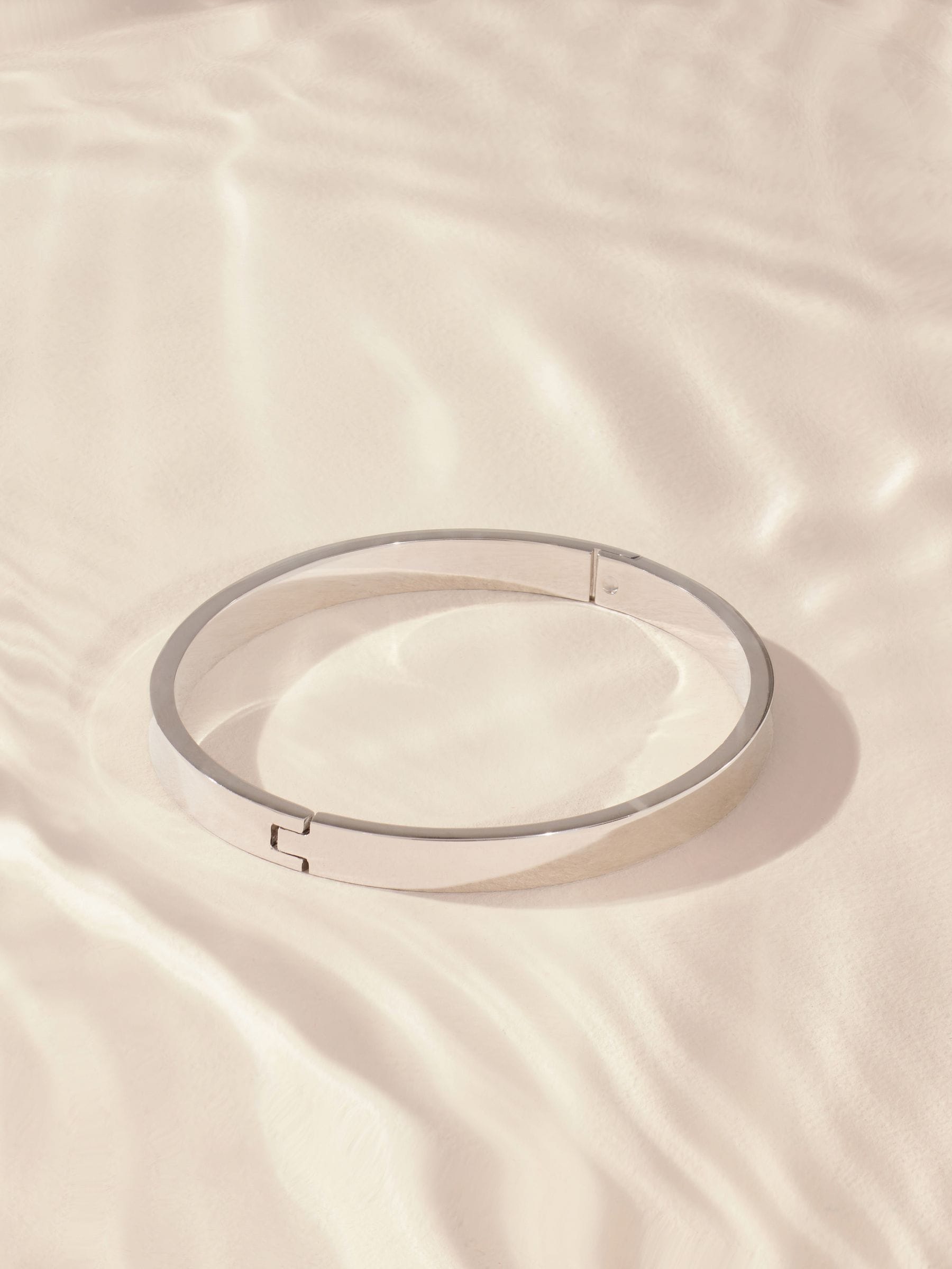 Silver tone stainless steel bangle (British brand)