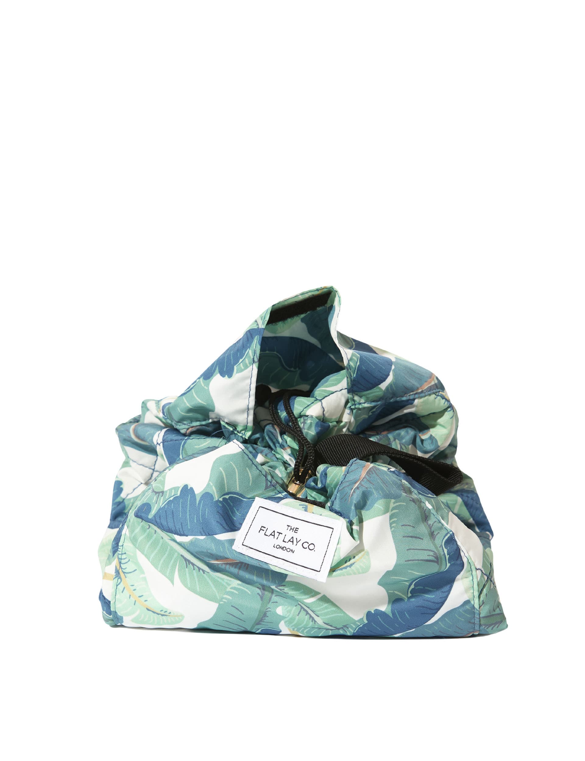 The Flat Lay Co. makeup bag Tropical Leaves design 52cm diameter, imported from the UK