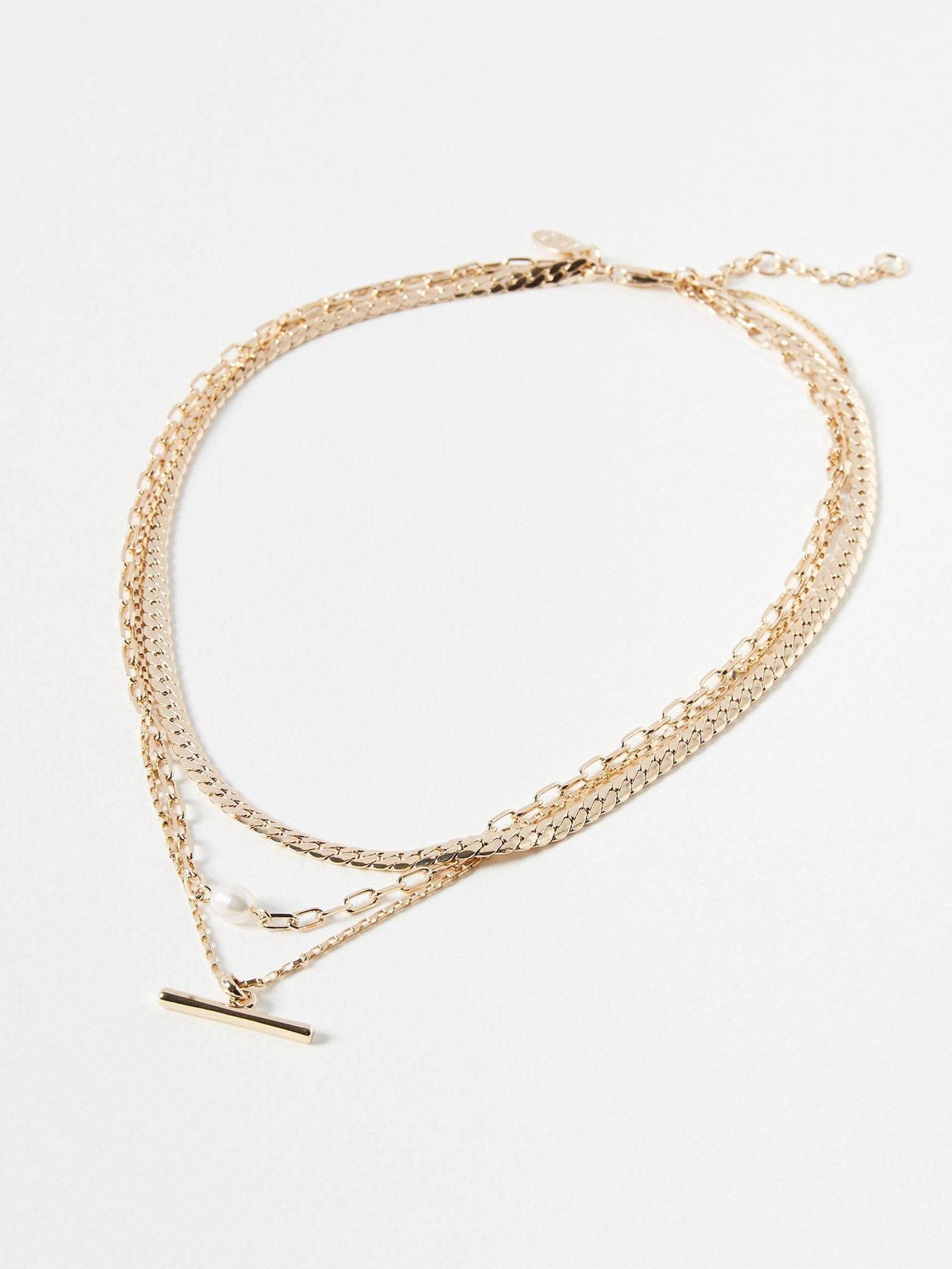 Oliver Bonas gold tone Rosalind chain freshwater pearl and bar layered necklace, imported from the UK