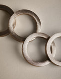 Set of four metallic napkin rings (British brand)