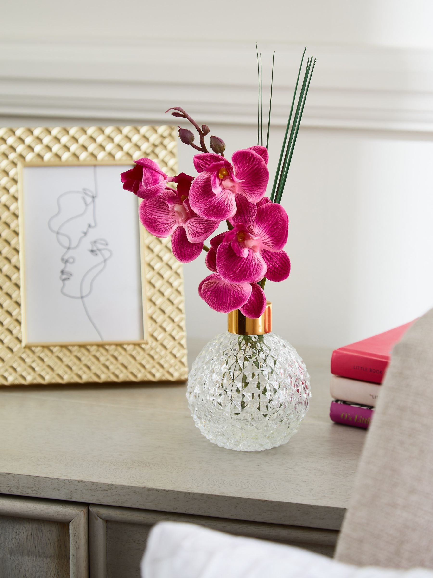 Pink artificial orchid in faceted glass vase 25cm height, imported from the UK