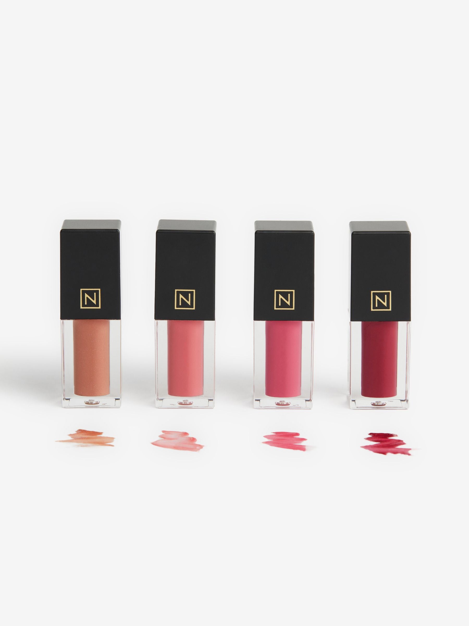 Set of 4 mini high shine lip gloss in Nuditude, Bon Bon, Rhubarb, Very Berry (British brand)