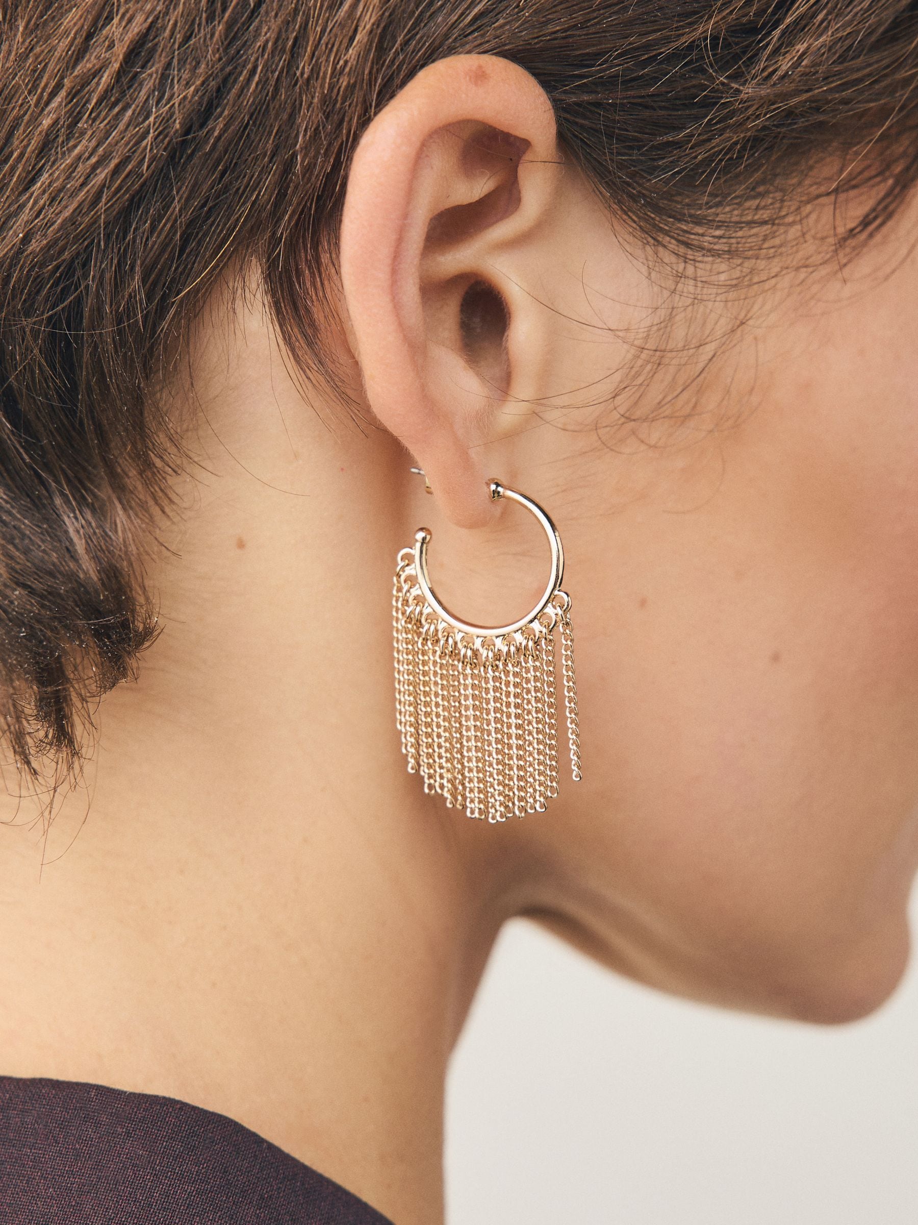 Gold tone tassel chain hoop earrings, UK version