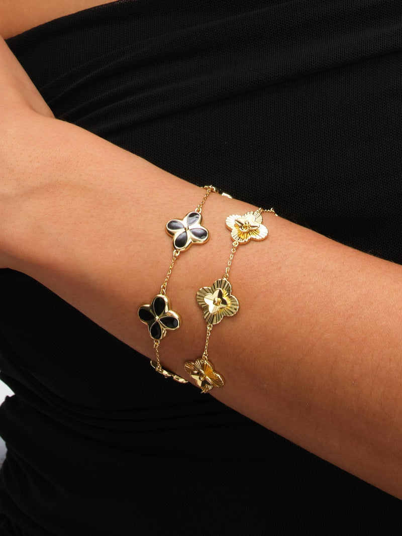 Inicio gold tone diamond cut clover station bracelet, UK version