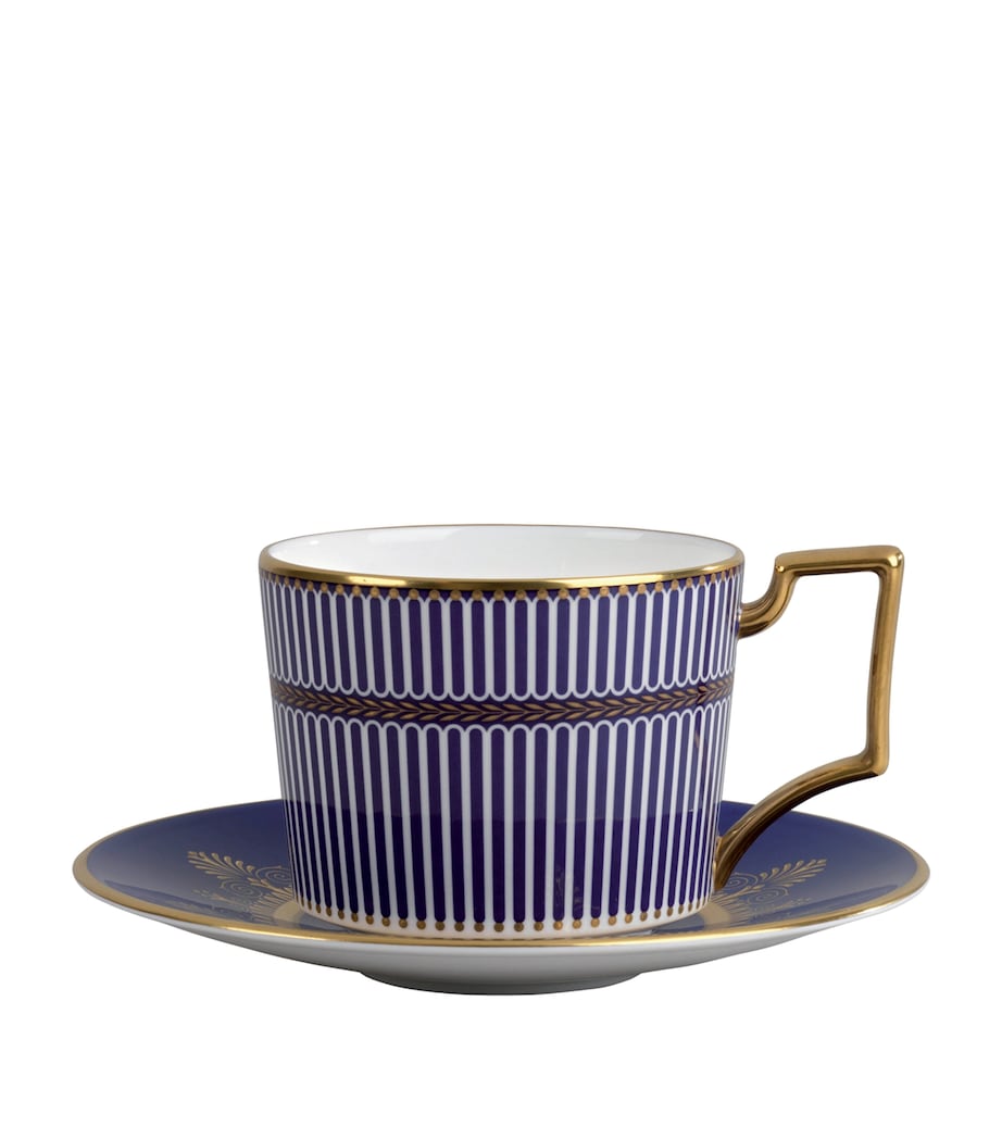 Wedgwood fine bone china teacup and saucer with blue and gold trim (British brand)