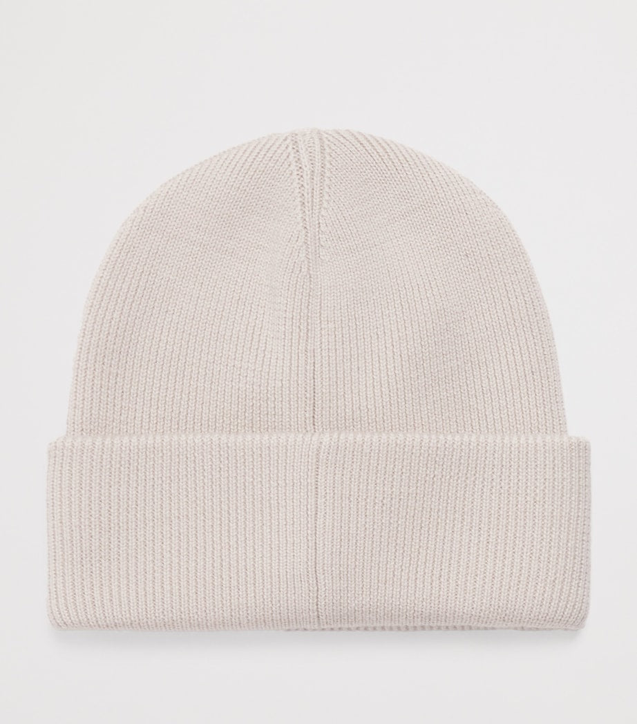 Moose Knuckles kids wool beanie with metal logo patch, imported from the UK